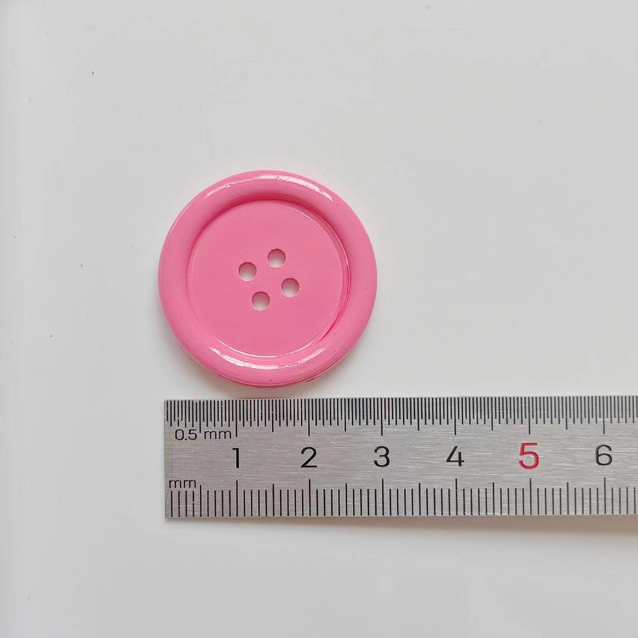 30mm glossy pink 4-hole plastic craft button with size ruler