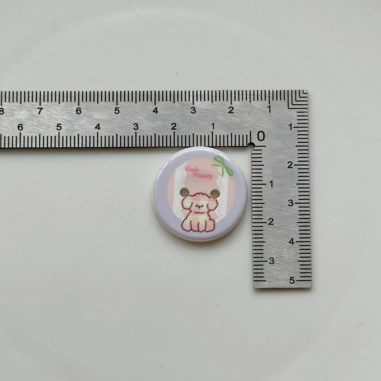 Single 25mm two-hole resin button, pastel puppy dog illustration