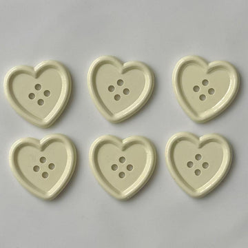 Shiny beige heart plastic craft buttons, heart design with 4 holes (6 shown)
