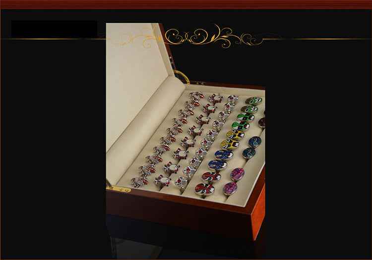 Open cufflink display box with beige inserts and multiple rows of cufflinks