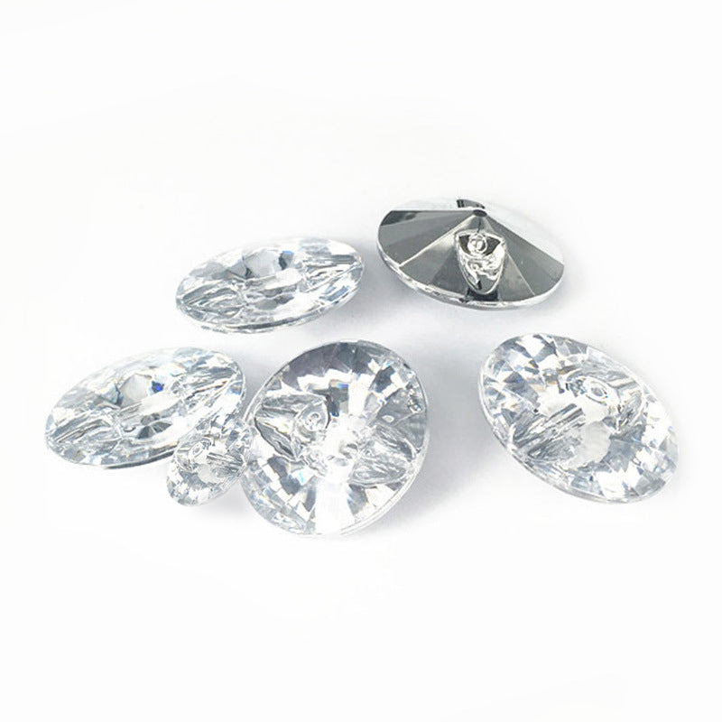 Assorted crystal-look acrylic buttons, faceted round design in white tones.
