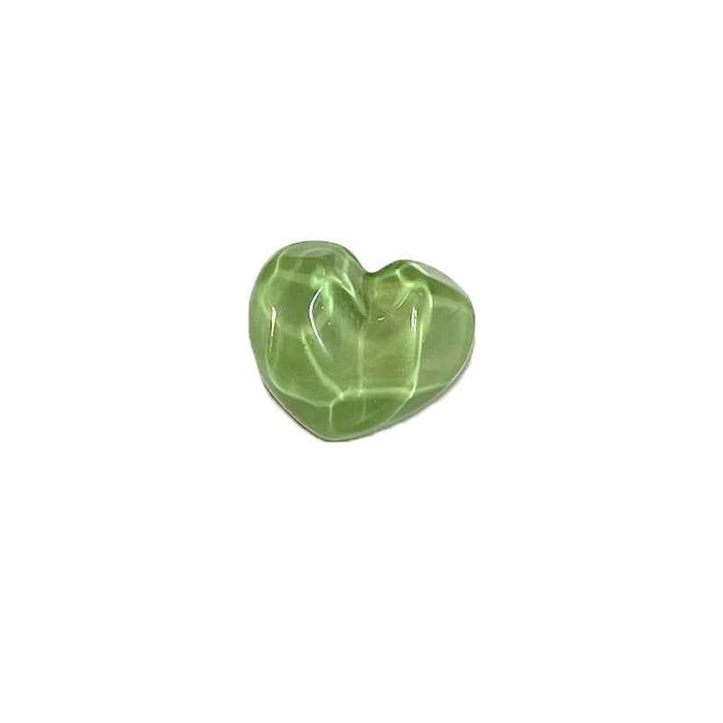 Heart-shaped resin shank button, translucent green, concave-convex surface