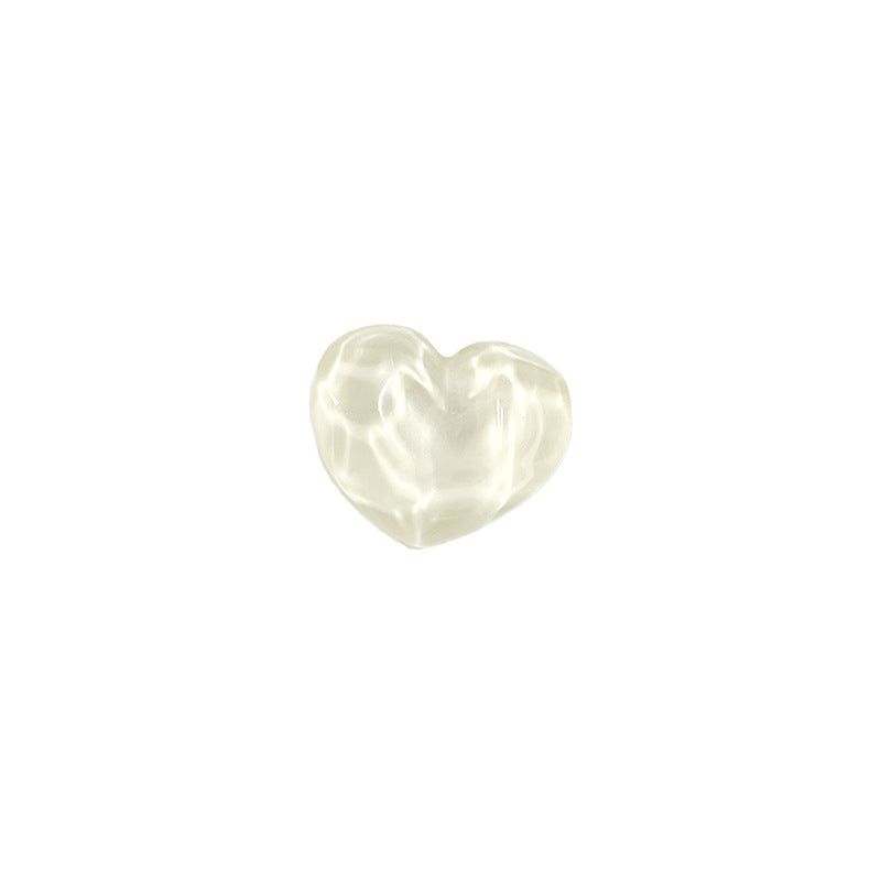 Heart-shaped resin shank button, translucent white, concave-convex surface