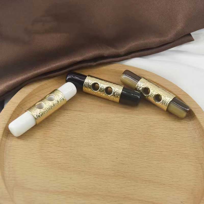 Toggle buttons set: white, black, and dark brown resin with gold front bars