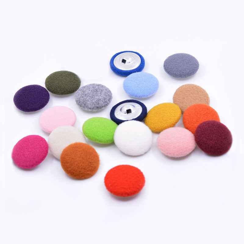 Fluffy round fabric-covered buttons with metal shank, mixed colors including green and orange