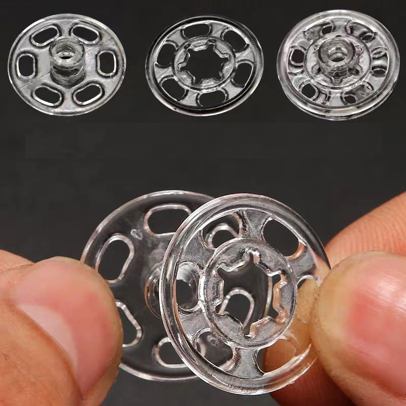 Silver-tone round nylon snap buttons, close-up of front metal discs