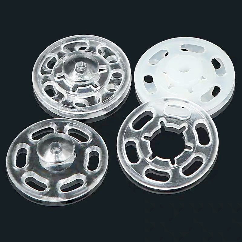 Silver and white round nylon snap buttons, visible ring and socket detail