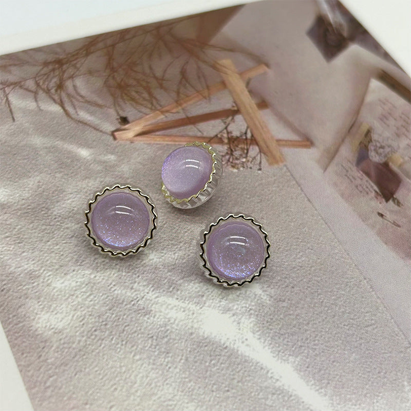 Purple glitter round buttons with scalloped metal rim and two shank grooves