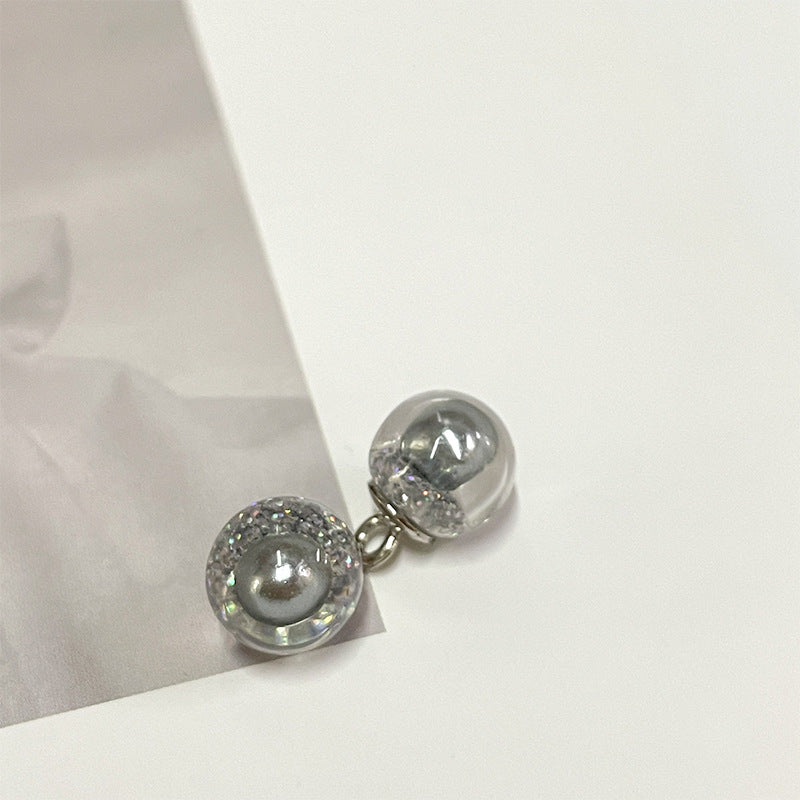 Silver glitter round pearl-style button with clear top and metal loop