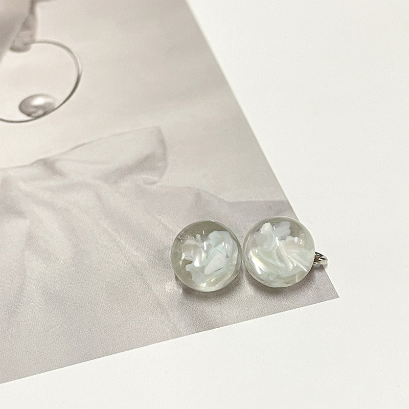 Clear white round pearl-style buttons with silver metal loop backs