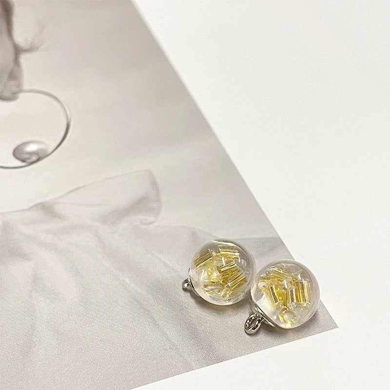 Yellow-gold foil round pearl-style buttons with clear front and silver loops