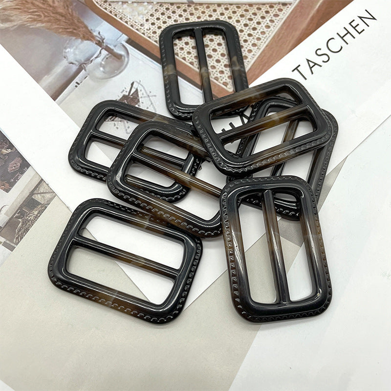 Assorted 40-mm resin D-ring buckles, black with brown inner bars