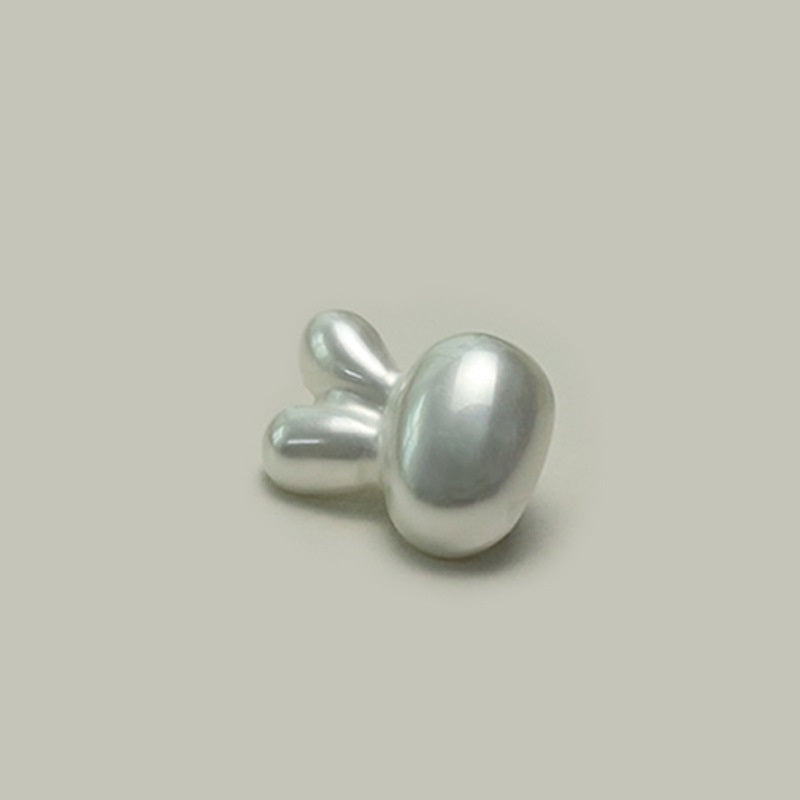 Plastic character button with metal shank, rabbit/mouse design, glossy light gray, side view