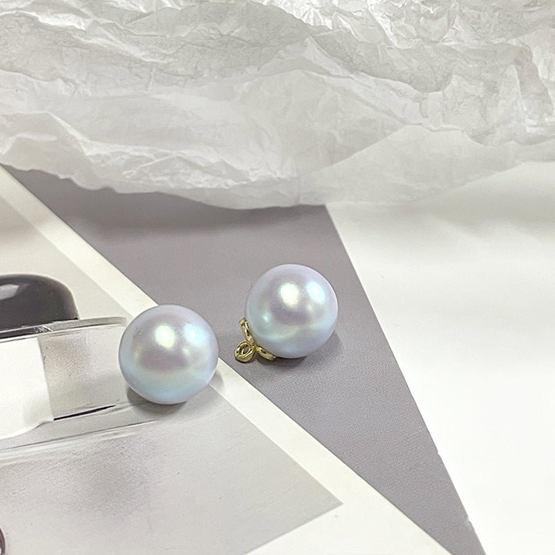 Pearl metal-base buttons, blue iridescent round with gold shank loops (2-pack view)