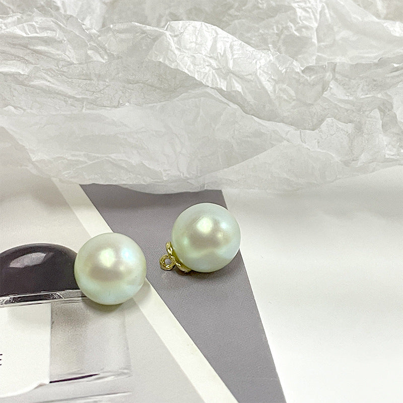 Pearl metal-base buttons, green iridescent round with gold shank loops (2-pack view)