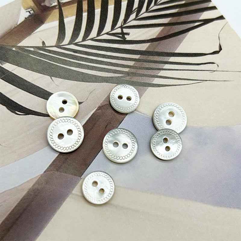 White mabe pearl shell buttons, round 2-hole design with scalloped textured border