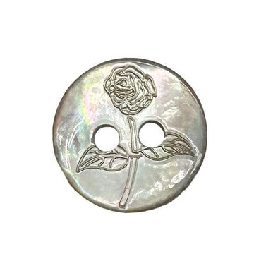 Round two-hole shell button with iridescent sheen and embossed rose pattern