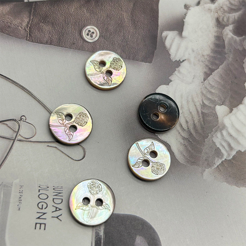 Set of round two-hole iridescent shell buttons with embossed rose motifs