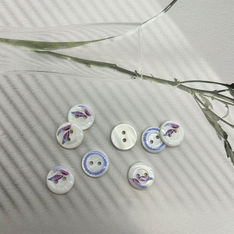 Round 2-hole shell buttons, mix of white leaf print and blue ring edging