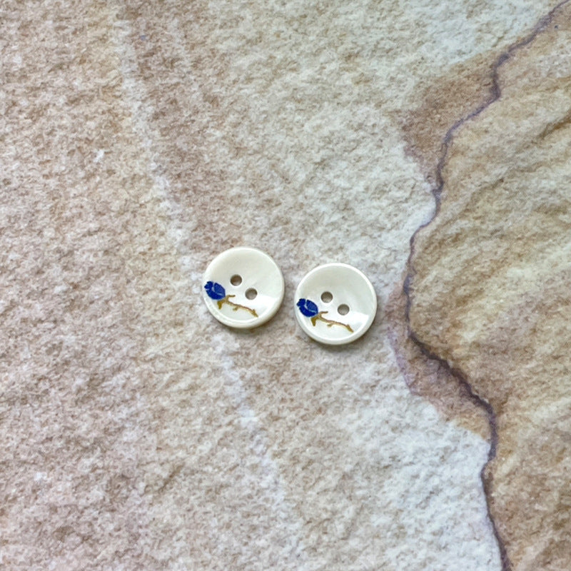11.5mm 2-hole shell buttons with blue rose pattern, pair