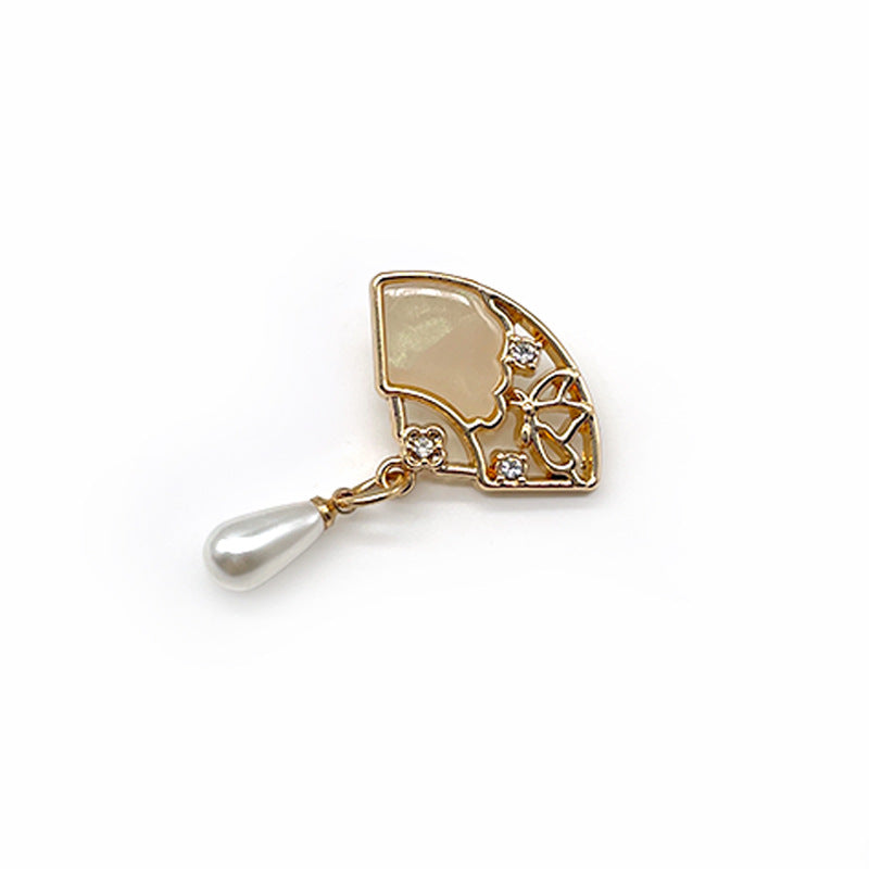 Gold fan metal shank button with hollow diamond trim and white pearl drop