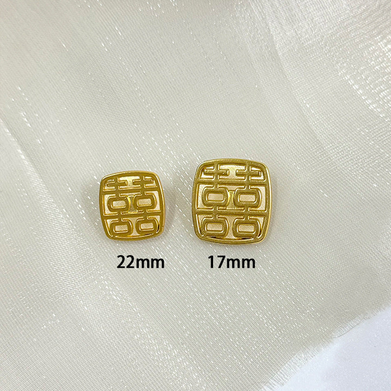 Gold Chinese character metal shank buttons: 22mm and 17mm on fabric