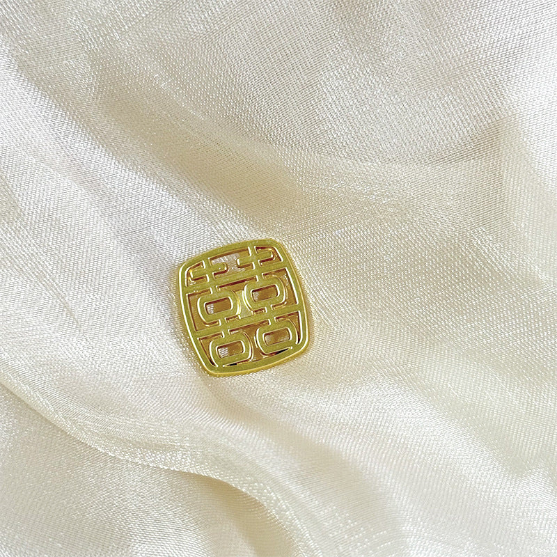 Gold square metal shank button with Chinese character motif and hollow center