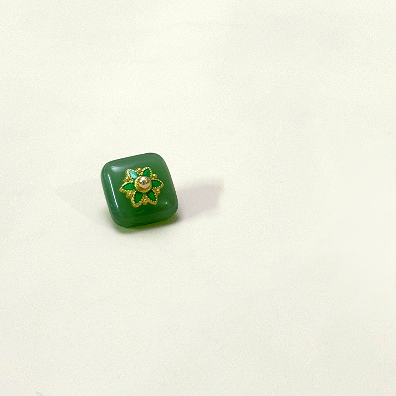 Square glass button with flower base, dark green with gold center