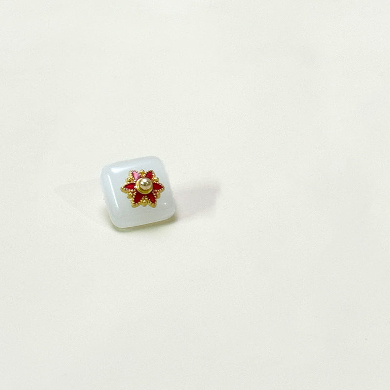 Square glass button with flower base, translucent white with red-green gold flower