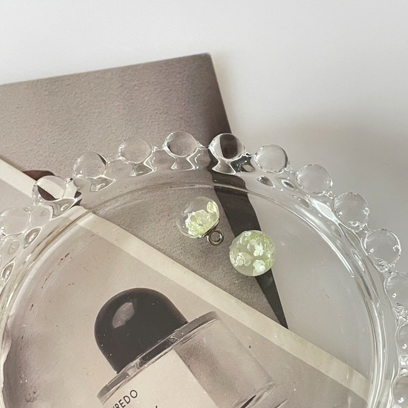 10mm transparent sequin bead buttons with green translucent centers and round loop