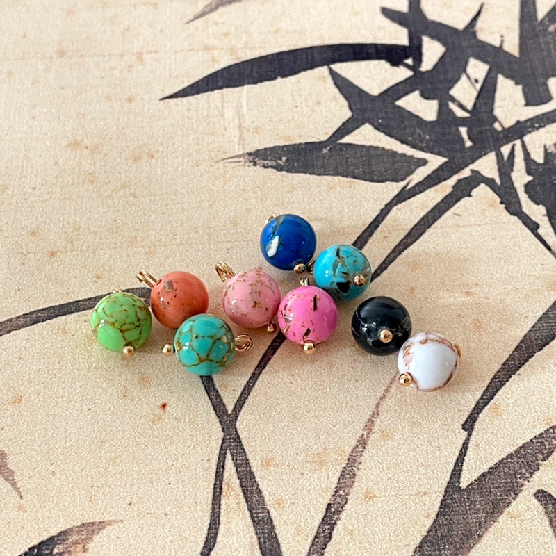 Assorted round jade-style buttons with gold-tone shanks in multiple colors