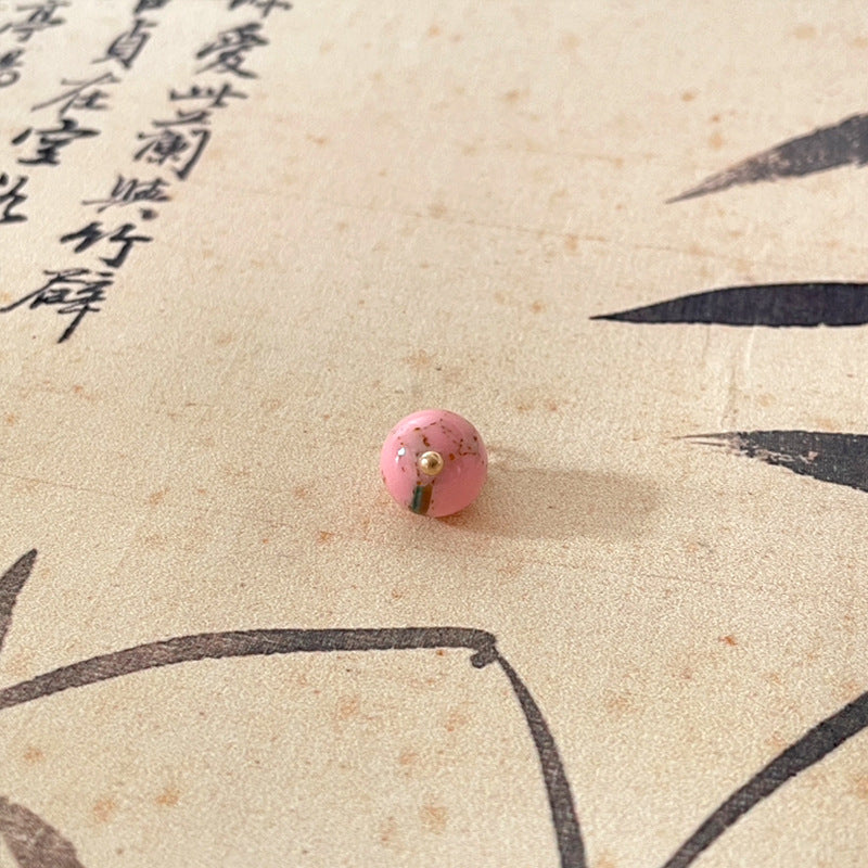 Light pink jade-style round button with gold-tone shank, Chinese knot style