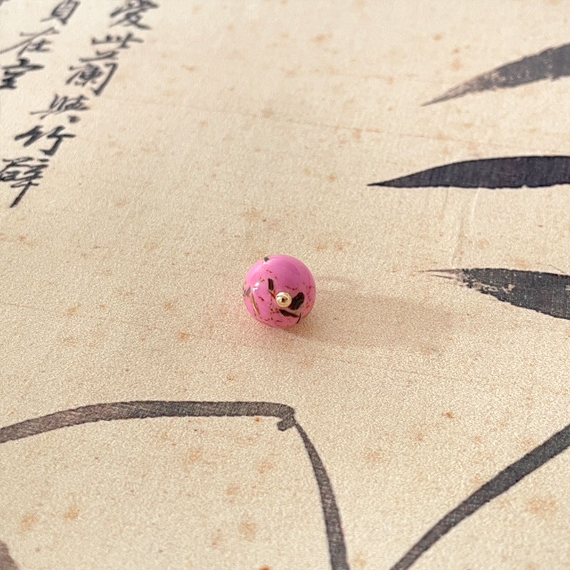 Pink jade-style round button with gold-tone shank, Chinese knot style