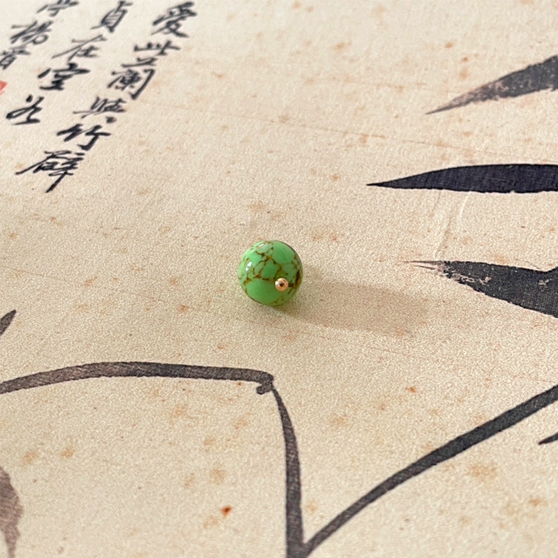Green jade-style round button with gold-tone shank, Chinese knot style