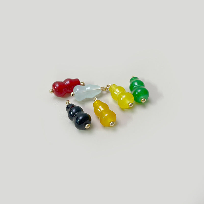 Assorted gourd-shaped glass buttons: red, light blue, yellow, dark green, gold loops