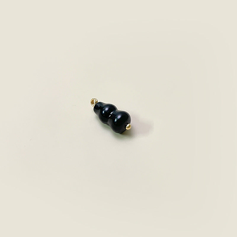 Black gourd-shaped glass button, 8x19mm, gold loop shank
