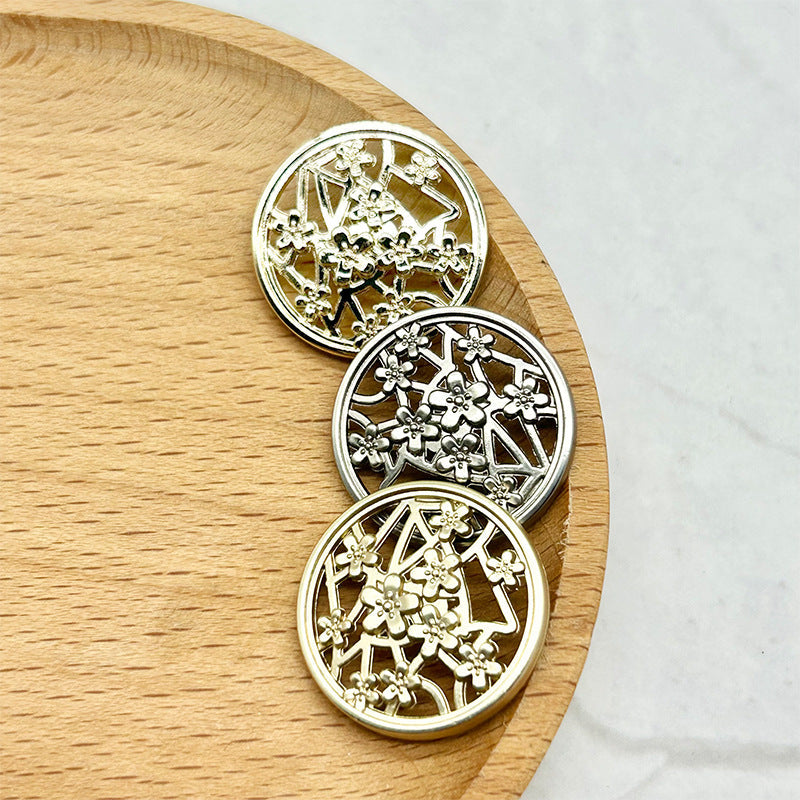 Matte gold, silver, and gold plum blossom hollow-shank buttons shown together