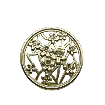 Gold metal button, hollow shank style with plum blossom floral cutout pattern