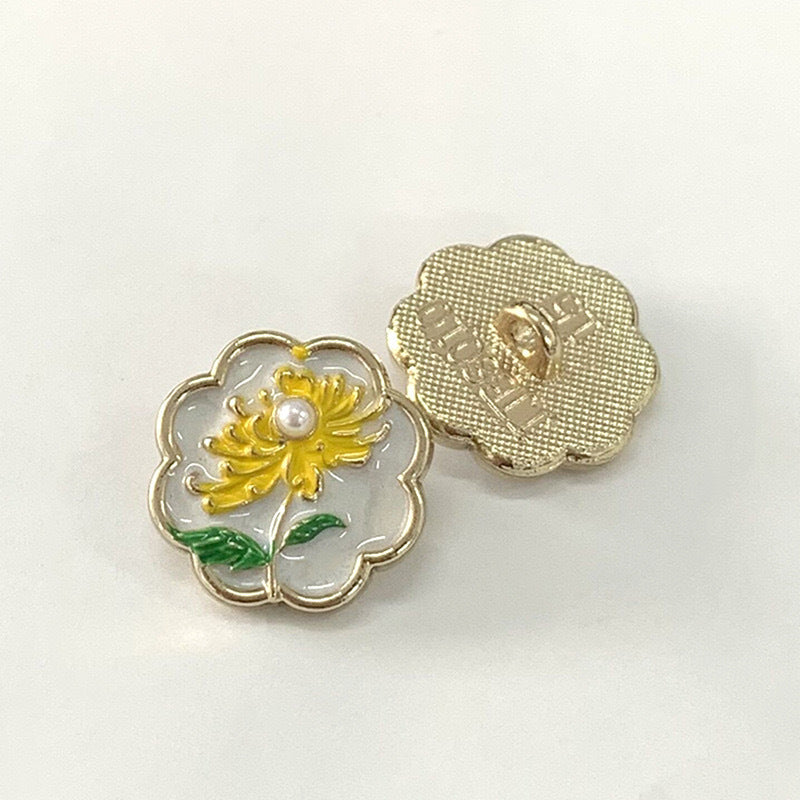 15mm vintage metal button with yellow chrysanthemum, green leaves, gold-tone back