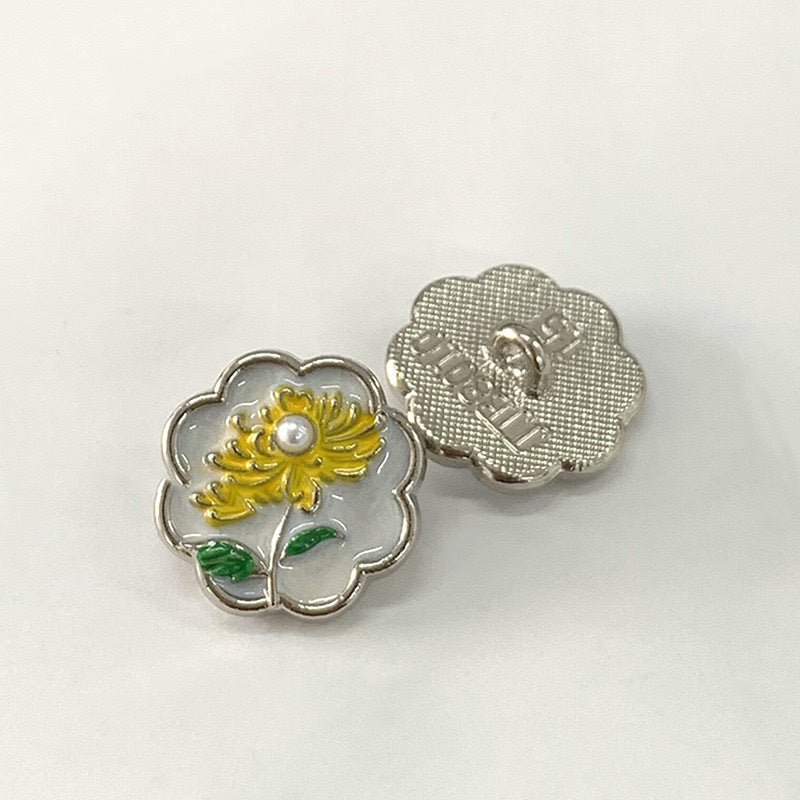15mm vintage metal button with yellow chrysanthemum, green leaves, gold-tone back