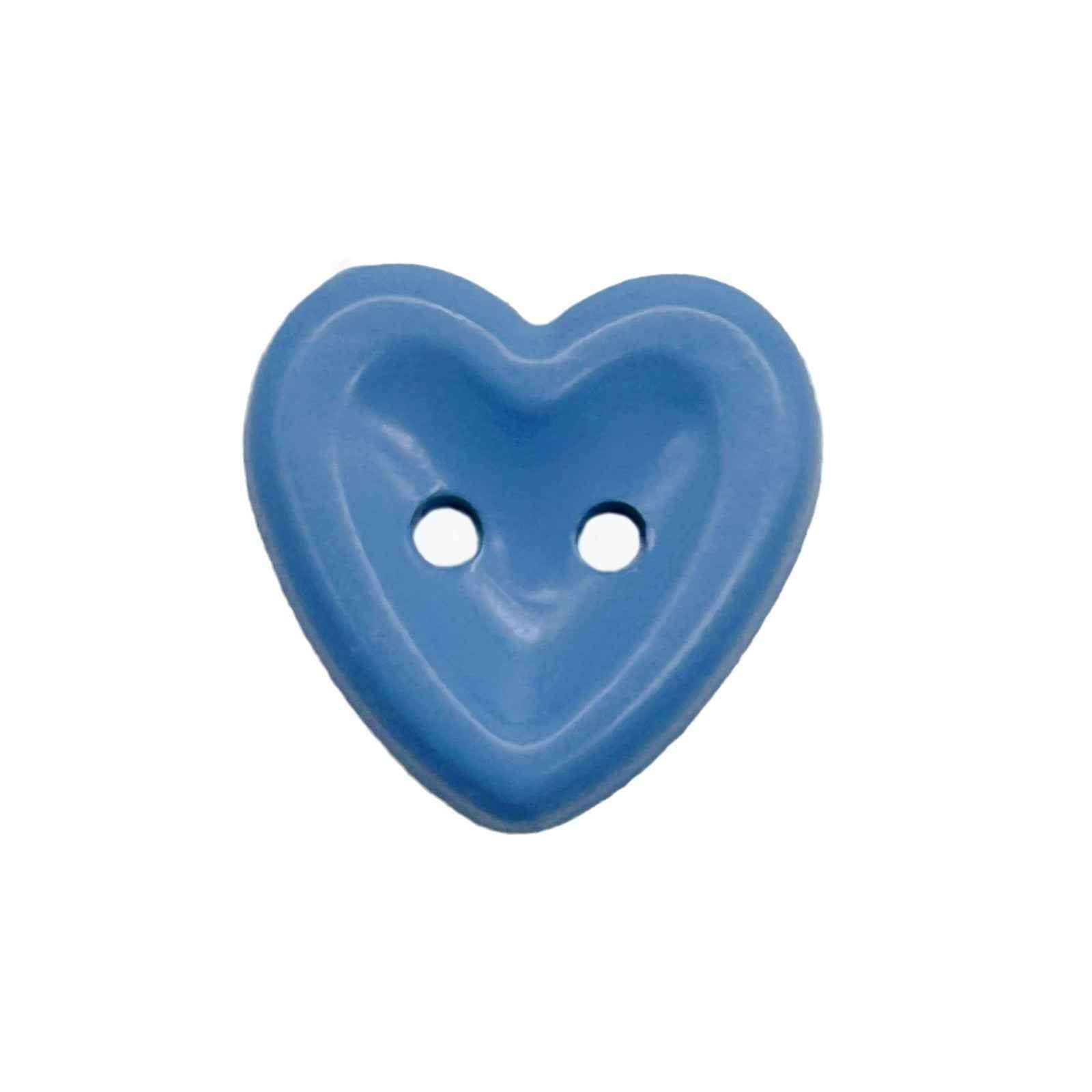 Light blue heart button with two holes for children’s sweater sewing