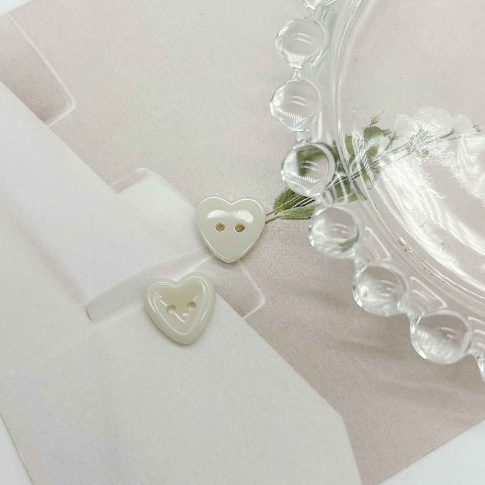 Two-hole heart buttons, white heart shapes with 2 holes