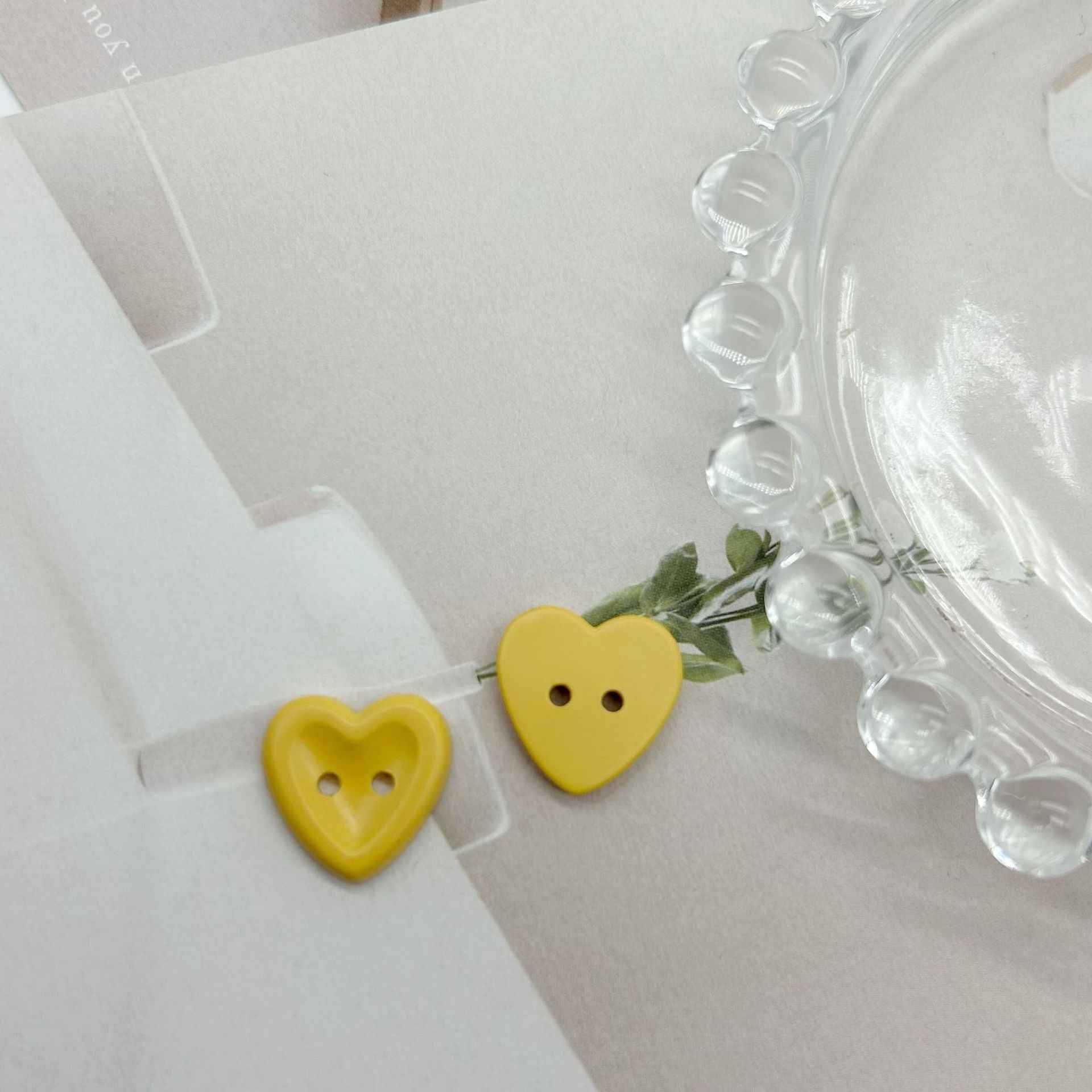 Yellow heart buttons with two holes, two-piece set
