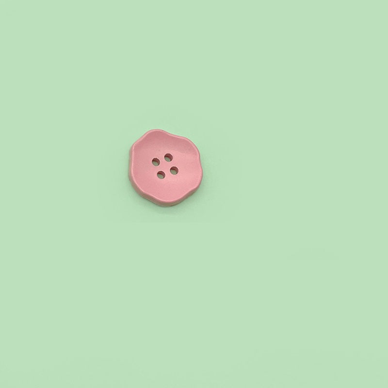 Pink flower-shaped 4-hole plastic button for children’s clothing