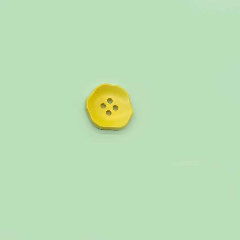 Yellow flower-shaped 4-hole plastic button for children’s clothing