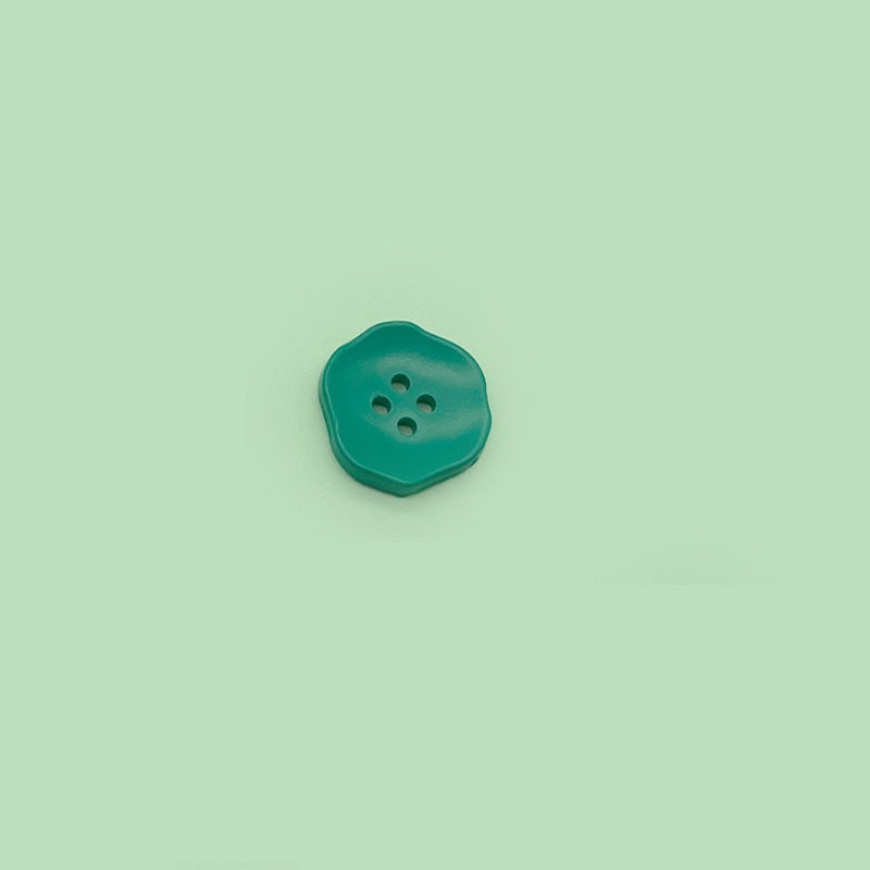 Teal green flower-shaped 4-hole plastic button for children’s clothing