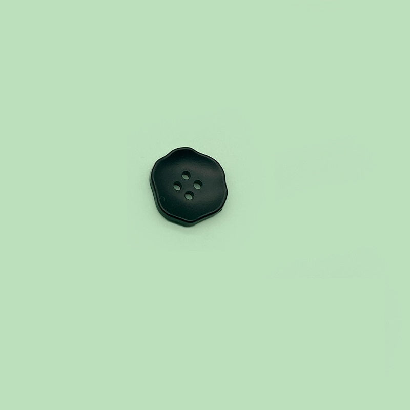 Dark (black) flower-shaped 4-hole plastic button for children’s clothing