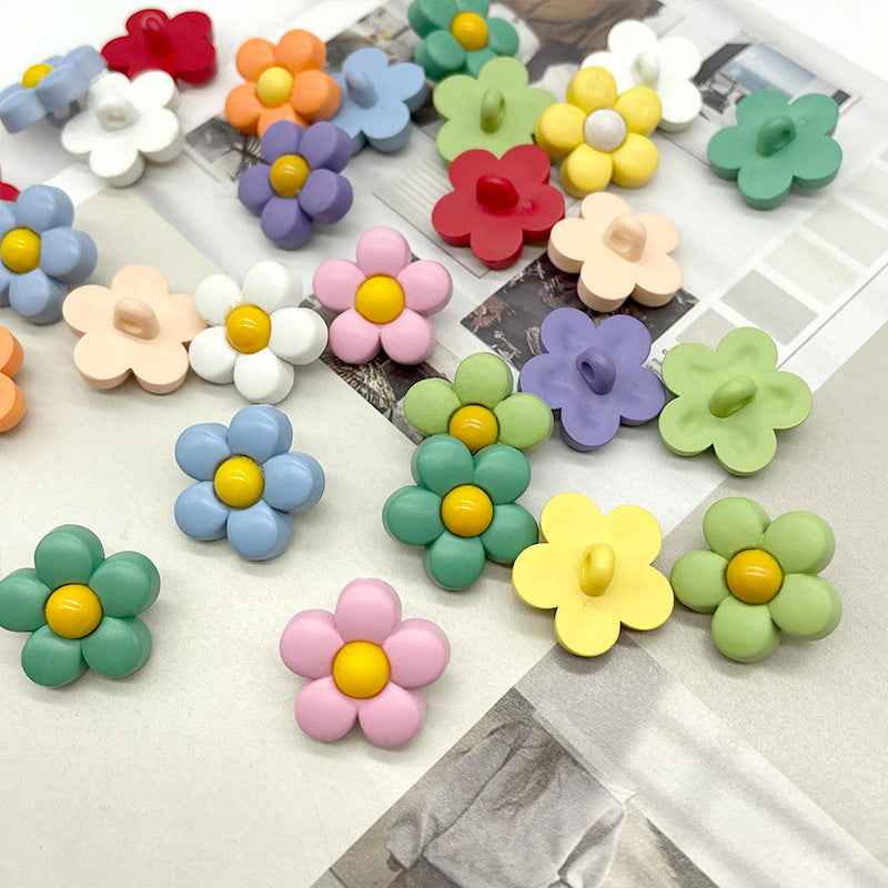 Colorful flower shank plastic buttons, assorted pale colors with yellow centers