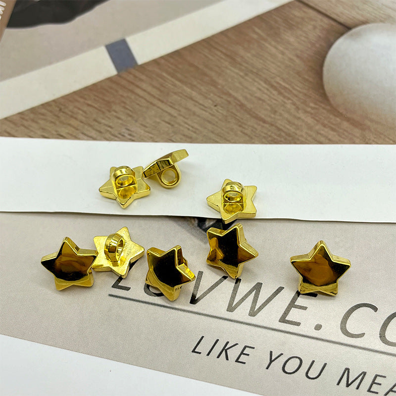 Gold five-point star plastic shank buttons on card, 100 pcs set