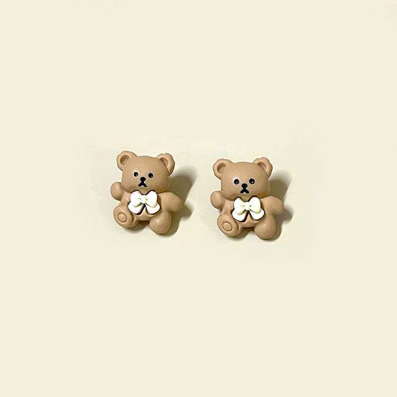 Cartoon brown bear resin button with white bow and rounded bear ears